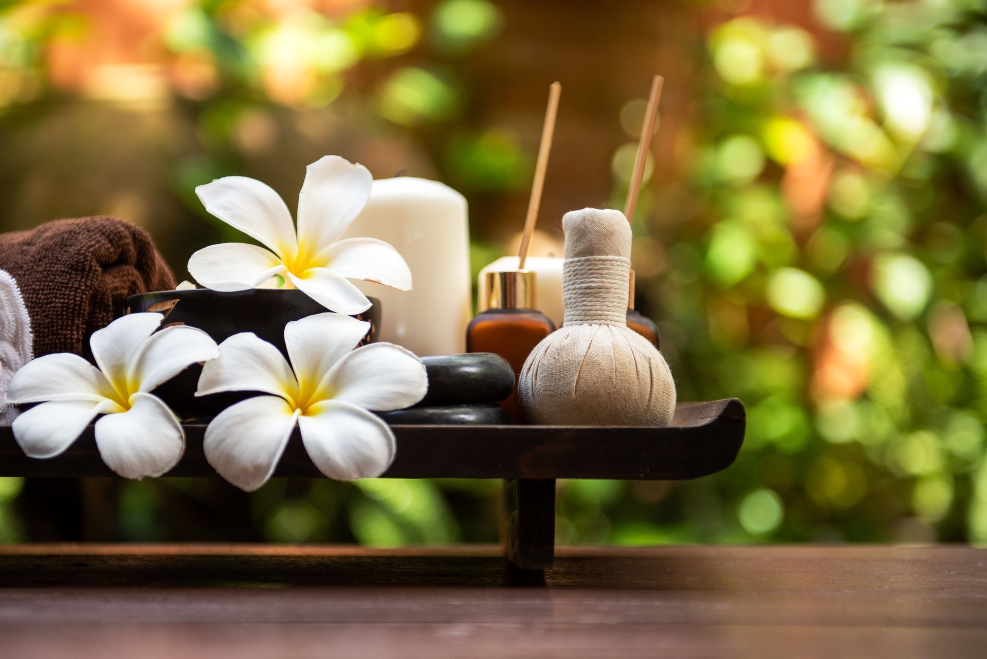 Spa beauty massage healthy wellness background. Spa Thai therapy treatment aromatherapy for body woman with flower Plumeria